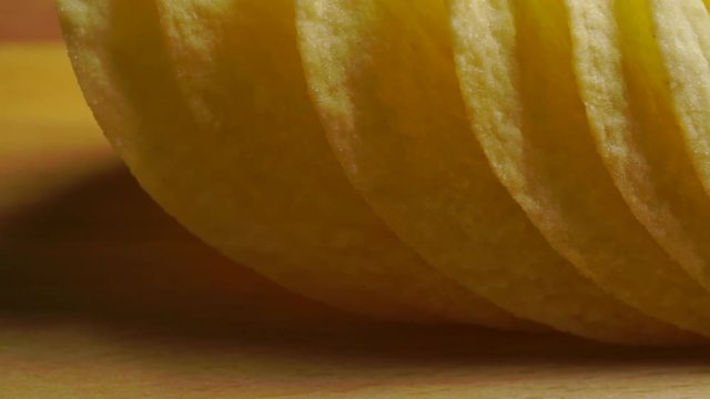 Row of potato chips close up dolly shot
