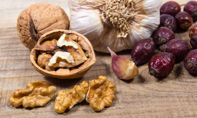 Dried fruit of hawthorn, garlic and walnuts. The concept of alternative medicine.