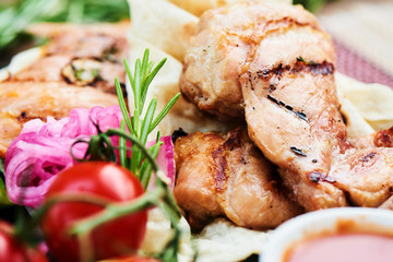 Fried bacon and zucchini with tzatziki sauce served on a stone Board closeup