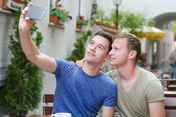 Shot of a young gay couple taking a selfie