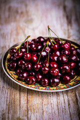 Fresh cherries on plate