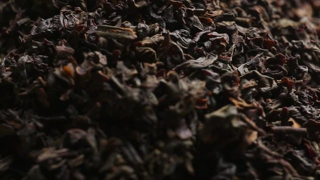 Rotating pile of black tea, macro video