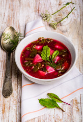 Soup with fresh young beet in bowl