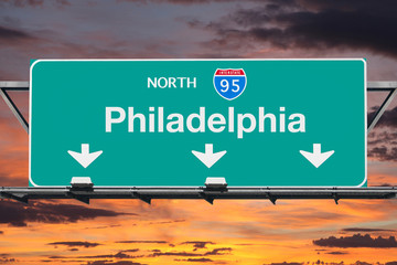 Interstate 95 Nouth to Philadelphia Highway Sign with Sunrise Sky