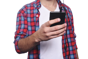 Young man listening to music with smartphone.