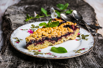 Piece of blueberry cake on serving plate