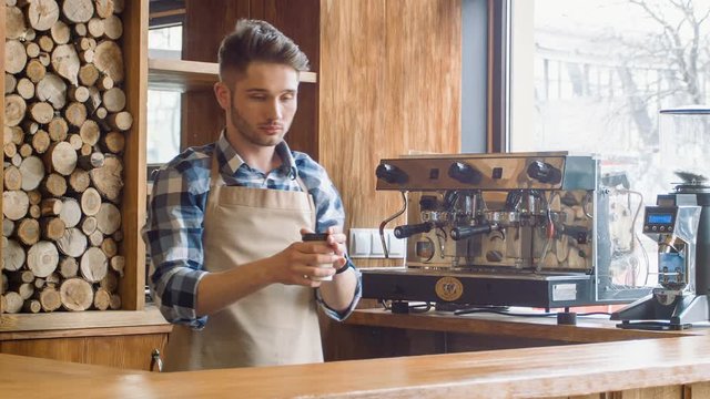 Professional barista working in the cafe