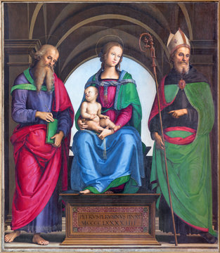 CREMONA, ITALY - MAY 24, 2016:  The panting of Madonna, St. John the Evangelist and St. Augustine by Petrus Perusinus (1493) in Cathedral of Assumption of the Blessed Virgin Mary.