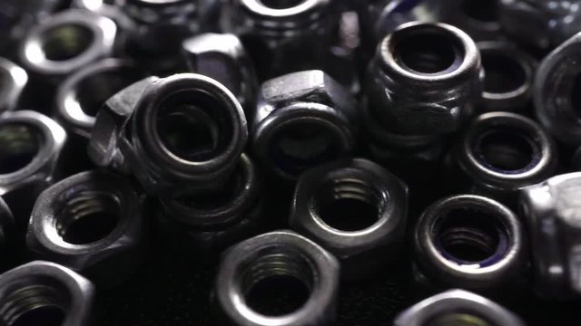 Pile of steel nuts dolly shot