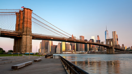 Alpenglow red on the Brooklyn Bridge New York