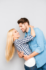 Portrait of happy cheerful smiling man and woman huging