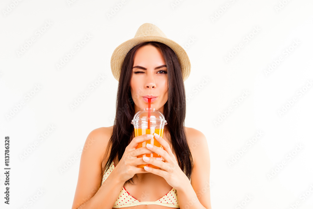 Sticker portrait of pretty tourist in summer hat drinking orange juice