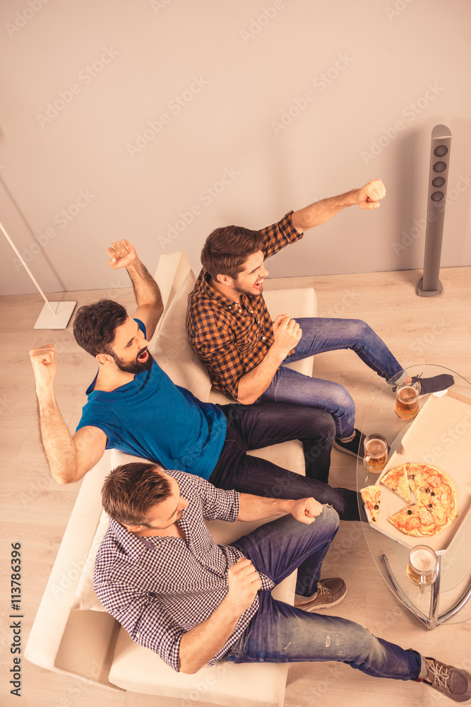 Poster top-view photo of happy cheerful men resting and watching tv