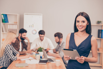 beautiful successful businesswoman at conference smiling  with t