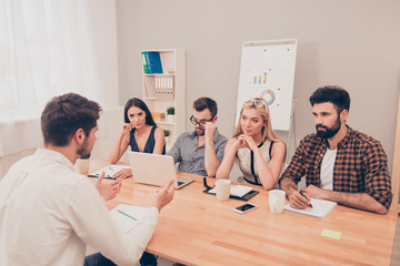 the young man is interviewed in order to get a job