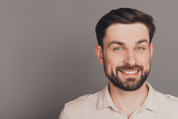 Handsome happy smiling man isolated on gray background