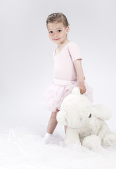 Portrait of Playful Little Caucasian Child. Posing With Big Toy.