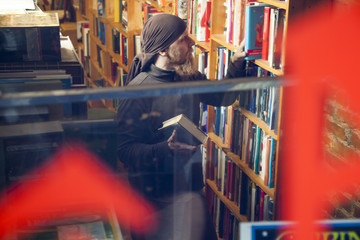 Person in books and antique store