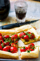 tart with cherry tomatoes and herbs