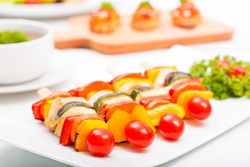 Barbecue chicken grilling on wood board.