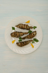 group salmon slices round white plate