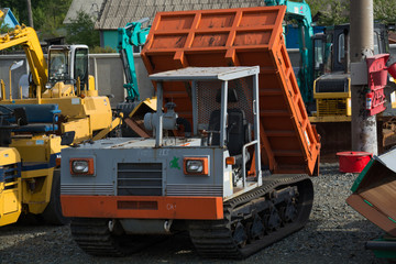 Fototapeta na wymiar Construction truck and other heavy duty equipment