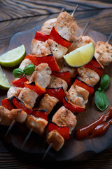 Close-up of barbecued chicken and bell pepper on skewers