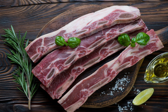 Raw fresh seasoned beef ribs, high angle view, close-up