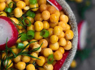background of wet peas sprinkled with dill and radish
