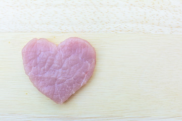 Fototapeta premium pork with heart shape on plate