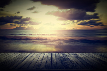 Fototapeta na wymiar Wooden pier with blurred motion seascape