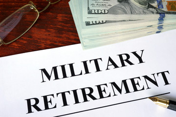 Military retirement written on a paper. Financial concept.