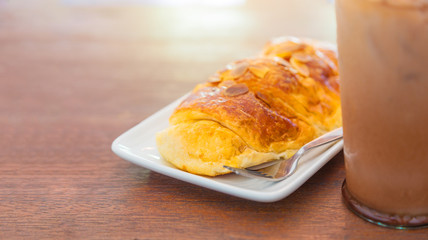 Almond croissant breakfast with cold chocolate drink