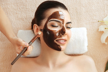 Young beautiful woman having spa procedure on her face - Powered by Adobe