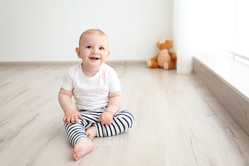 Fototapeta premium Baby boy sitting in the room