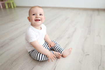 Baby boy sitting in the room