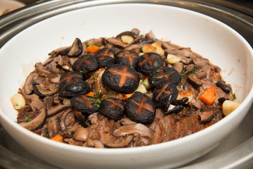 food in dish garnished with mushroom