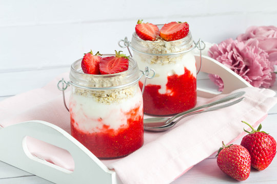 Strawberry fruit yogurt  for breakfast with fresh fruit served on kitchen tray