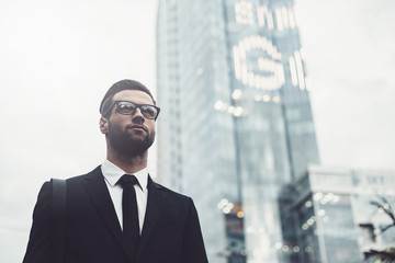 Fototapeta premium Businessman in city. 