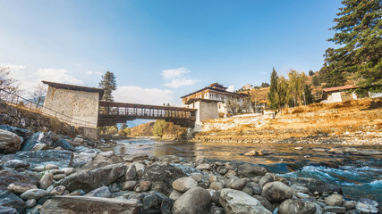 The bridge across the river with traditional bhutan palace, Paro