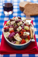 Greek salad with feta cheese olives tomatoes cucumber and onions