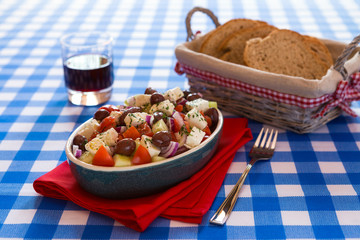 Greek salad with feta cheese olives tomatoes cucumber and onions