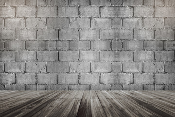 concrete cement brick block wall and wooden floor perspective with the light on the top corner