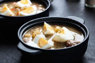 The sour soup made of rye flour with eggs