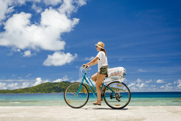 Fototapeta premium Woman ride along The Beach