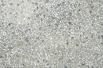 Grey wash gravel wall texture background.