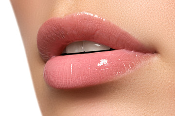 Perfect smile. Beautiful full pink lips. Pink lipstick. Gloss lips. Make-up & Cosmetics