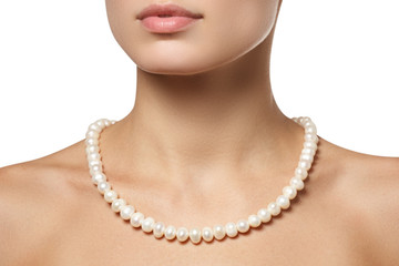 Beautiful fashion pearls necklace on the neck. Jewellery and bijouterie