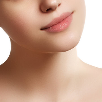 Close-up of woman's lips with fashion natural beige lipstick