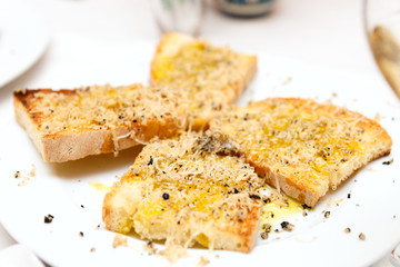 White bread with olive oil and black truffle